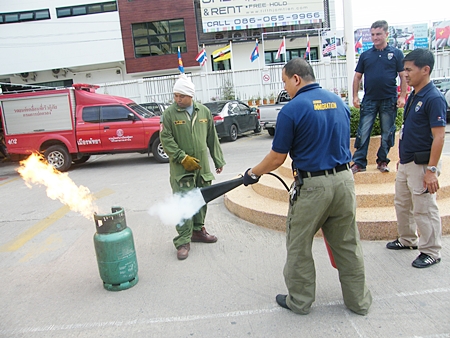 Immigration officials are given realistic hands on training in basic fire-fighting techniques using extinguishers.